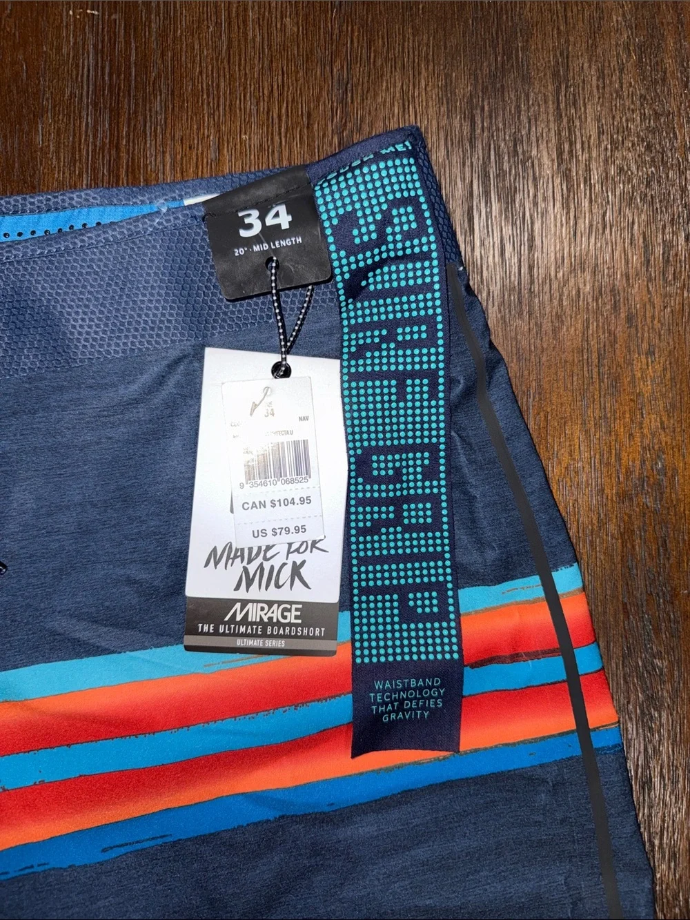 Rip Curl Mirage Mick Fanning Navy Board Shorts with Red & Aqua Stripes 34